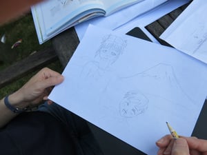 Silver drawing workshops taking place at home with family members