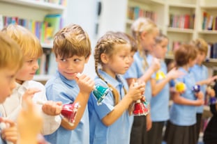 Group of school children with hand bells