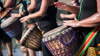 An African drumming group. Photo by Lee Pigott on Unsplash